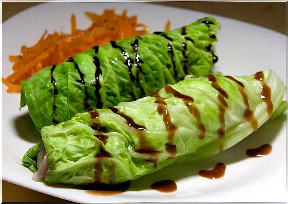 Dish made with cabbage and chicken rolls.