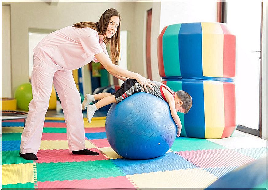 Physiotherapist with child