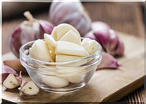 Garlic cut in a bowl.  Caffeine withdrawal remedy.