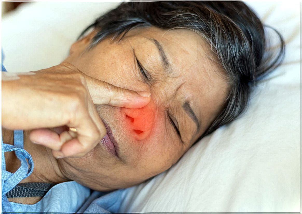 Woman touches her nose asleep to eat snot.